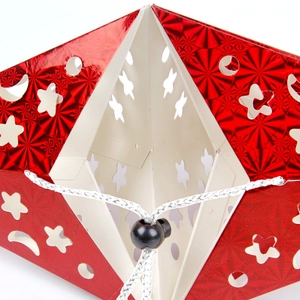 Holographic red star hanging ornament with laser-cut moon patterns and white frame