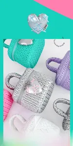 Detailed close-up of quilted cosmetic bag with woven handle and heart-shaped ribbon charm
