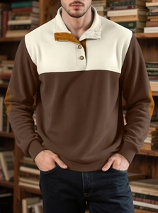 Detailed waffle texture of men's half-button pullover with brown faux leather elbow patches