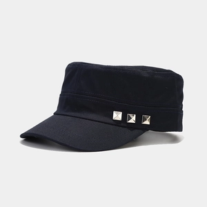 Close-up of navy canvas military cap with three silver square rivet decorations