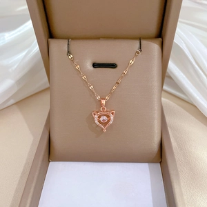 Elegant rose gold fox necklace with sparkling crystals displayed in a velvet jewelry box