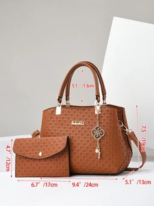 Close-up of brown textured tote bag set with dimensions and golden floral charm details