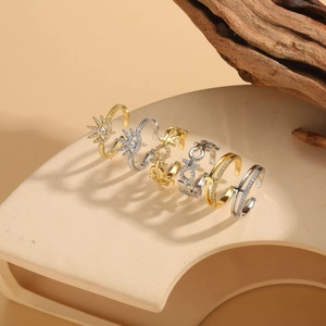 Detailed view of six-piece geometric adjustable ring set with gold and silver zircon styles