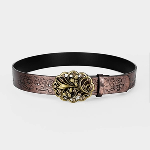 Detail of vintage embossed leather belt with bronze bee and floral diamond buckle