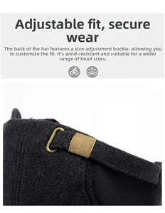 Detail of adjustable bronze metal buckle on a black wool winter baseball cap for men