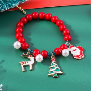 Detailed view of Christmas charm bracelet with Santa Claus and reindeer festive pendants