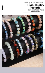 Three-tier jewelry stand displaying colorful beaded bracelets and high-quality wristbands