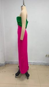 Detail of green and pink color-block tube dress showing the fabric on a mannequin
