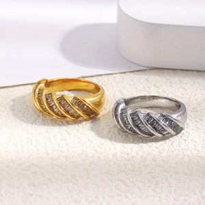 Detailed macro shot of 18K gold plated twisted ring with rectangular zircon pave setting