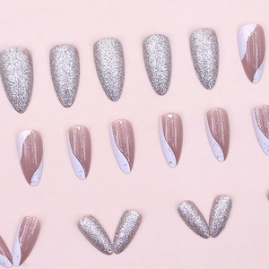 Long stiletto press-on nails with silver glitter and nude white wavy wave designs