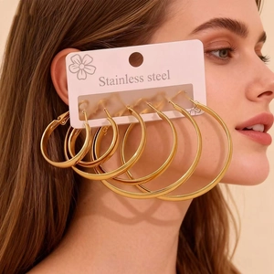 Set of 6 pairs of gold stainless steel hoop earrings in various sizes for women