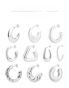 Matrix display of nine geometric silver stud earrings with ribbed and twisted patterns