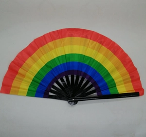 Detail view of foldable rainbow hand fan with black ribs and vibrant polyester fabric