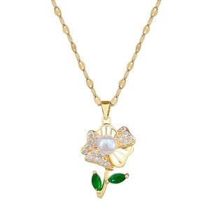 Elegant gold titanium necklace with hollow floral pendant featuring green gems and pearls