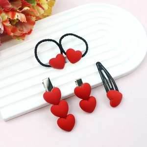 4-piece red heart hair accessory set with scrunchie and clips on white display tray