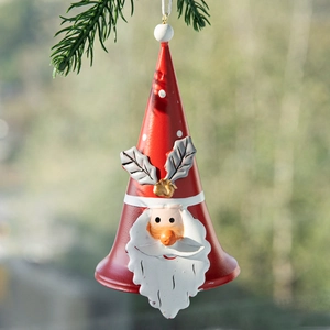 Christmas Santa Claus painted iron bell ornament hanging on a green pine branch