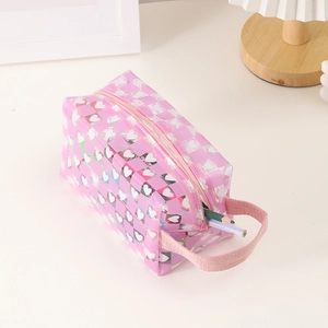 Close-up of pink checkered transparent pencil case with heart patterns and large capacity