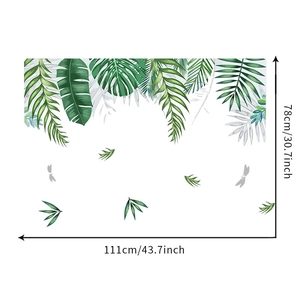 Detail of green tropical leaf wall decal showing dimensions 111cm wide by 78cm high
