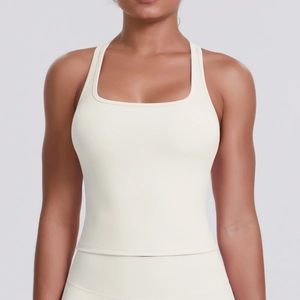 Close-up of cream racerback sports bra with square neck design and supportive ribbed fabric