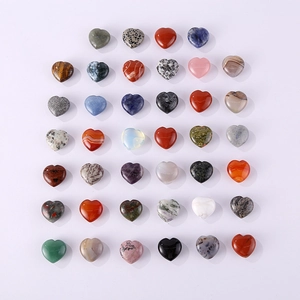 Assorted heart-shaped natural crystal stones in various colors and polished finishes