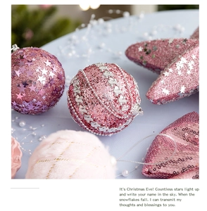 Detailed view of pink Christmas ornaments with glitter, sequins, and faux fur textures