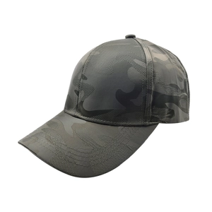 Detail of a dark gray camouflage baseball cap showing a 45-degree angle and curved brim