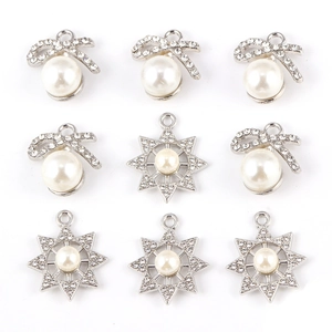 Bow and star pendant charms with pearls and rhinestones in silver-tone alloy