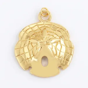 Detailed macro view of a gold shell pendant with fine grid texture and center flower relief