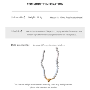 Detail of freshwater pearl necklace featuring heart pendant and alloy metal components