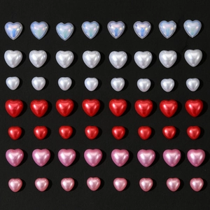 Mixed sizes 3D heart charms in iridescent white, metallic red, and pink for DIY nail art