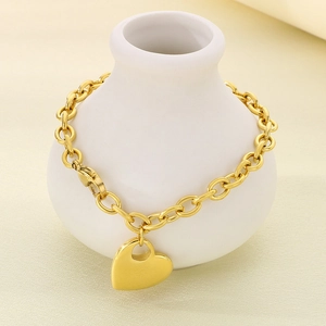 Elegant gold stainless steel chunky chain bracelet with a polished heart pendant charm