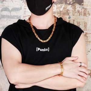 Detailed close-up of golden coffee bean link chain necklace and matching bracelet set