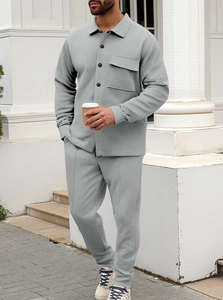 Detail view of grey waffle knit texture on casual long sleeve shirt and matching trousers