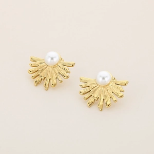 Detailed view of gold fan-shaped stud earrings featuring a centered white pearl inlay