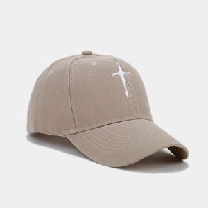 Detailed side view of khaki cotton baseball cap with white star embroidery detail