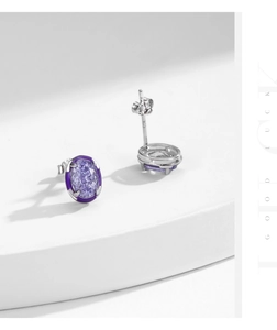 Detailed macro shot of oval purple zircon studs in 925 sterling silver with 925 hallmark