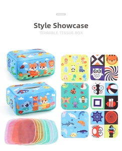 Detailed view of baby tissue box toy set with animal print cloth books and colorful fabrics