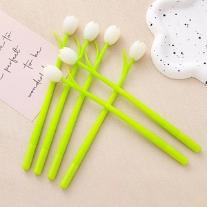 Creative color-changing tulip gel pens with white petals and green stems on a desk
