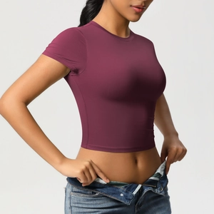 Detail of burgundy crop top slim fit fitness t-shirt made with high elastic fabric