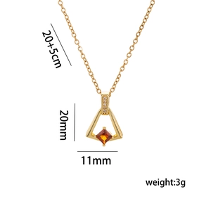 Golden skirt pendant necklace with orange gemstone and cubic zirconia details