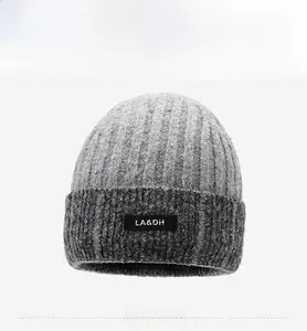 Detailed view of the thick ribbed knit texture and brand label on a winter beanie