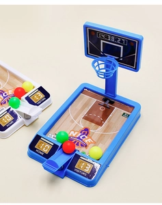 Close-up of mini tabletop basketball game with spring launcher and colorful toy balls