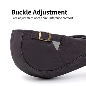 Adjustable dark grey cotton flat cap with vintage brass metal buckle closure detail
