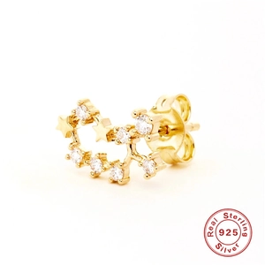 Macro detail of S925 sterling silver star and moon earring with clear zircon inlay