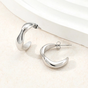 Geometric irregular C-hoop earrings in polished stainless steel with wavy texture