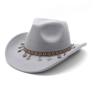 Detail of grey felt cowboy hat with ethnic woven band and antique bronze coin pendants