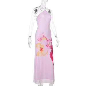Detail of pink halter neck maxi dress featuring vibrant blue orchid floral prints