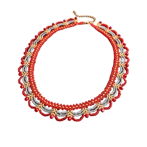 Handmade woven beaded necklace with red and gold glass beads in a scalloped fan design