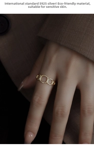 Close-up of minimalist S925 silver hollow geometric ring in gold finish on a hand