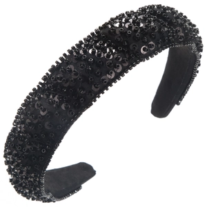 Close-up of handmade wide padded headband with black beads and shimmering sequins detail
